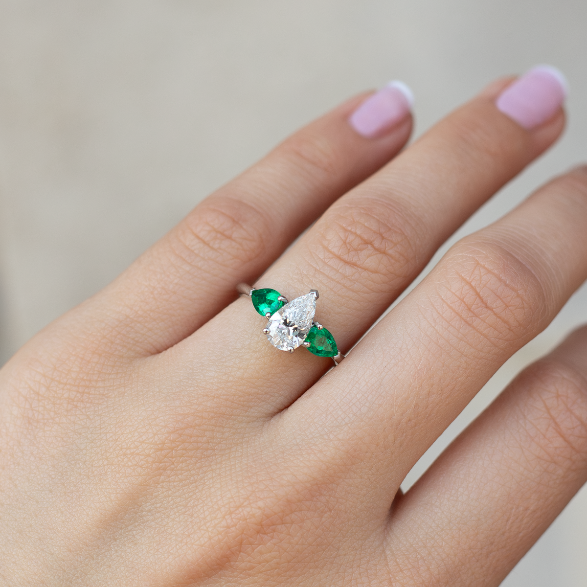 1.02ct Certified Pear Cut Diamond And Emerald Three Stone Ring