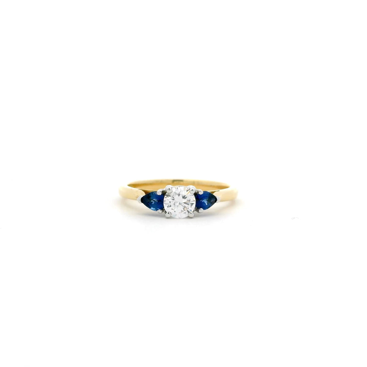 0.40ct Round Diamond And Pear Cut Sapphire Three Stone Ring