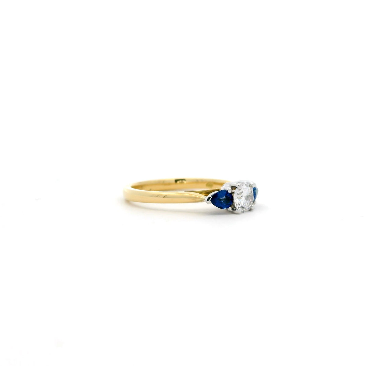 0.40ct Round Diamond And Pear Cut Sapphire Three Stone Ring