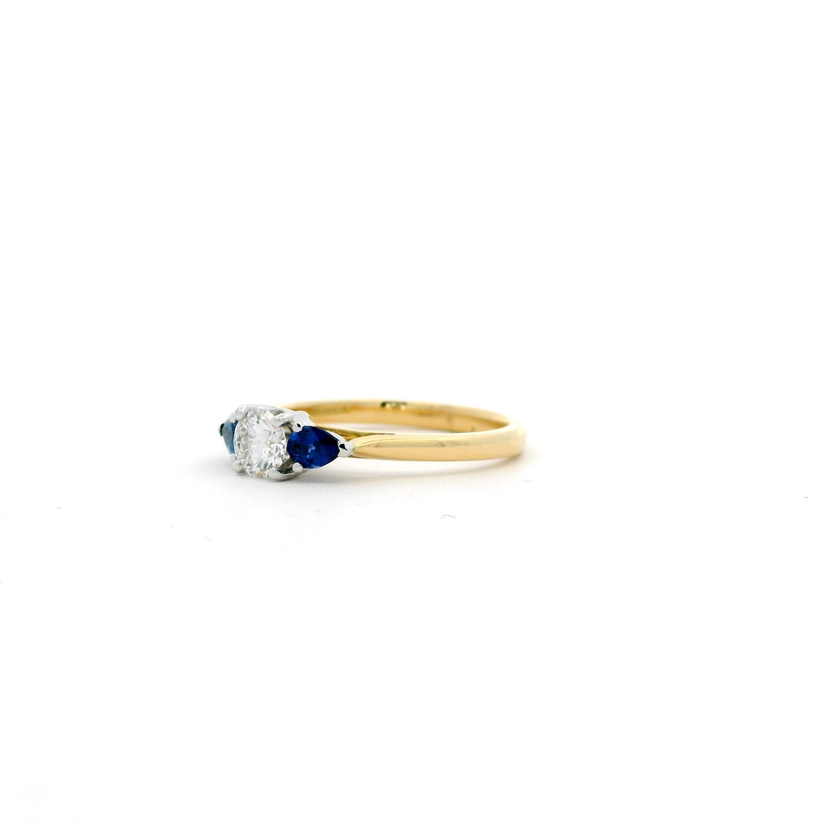 0.40ct Round Diamond And Pear Cut Sapphire Three Stone Ring
