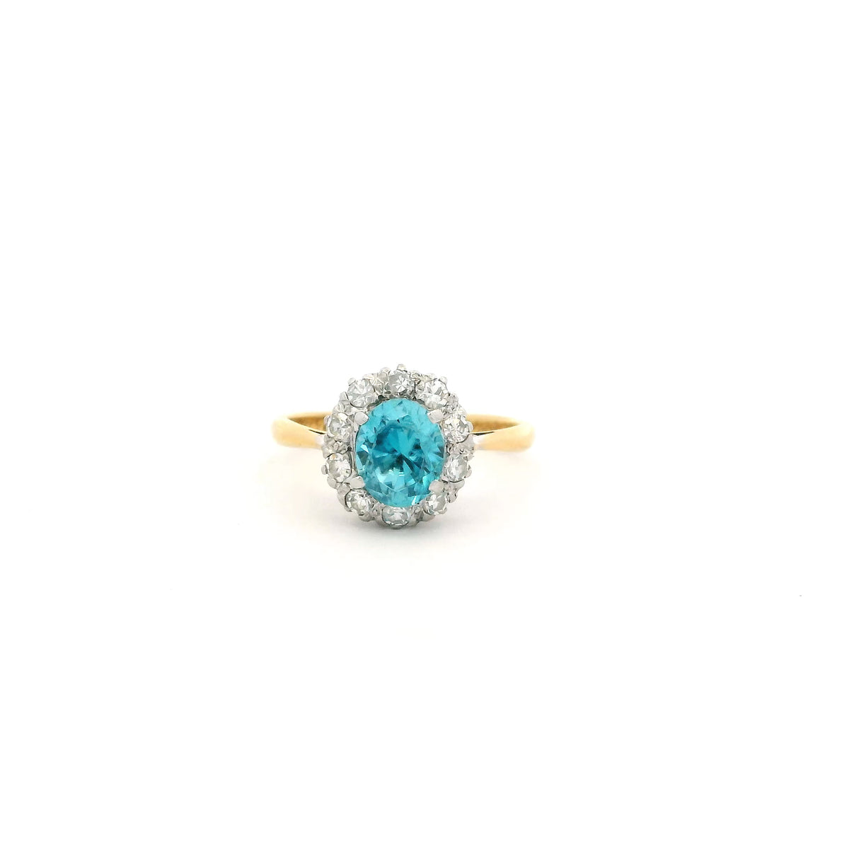 Oval Blue Zircon And Round Diamond Cluster Ring