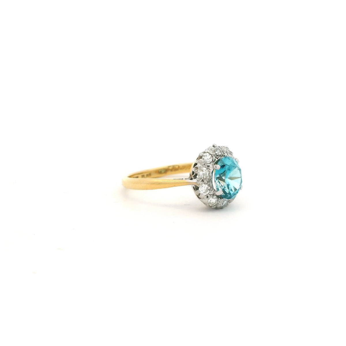 Oval Blue Zircon And Round Diamond Cluster Ring