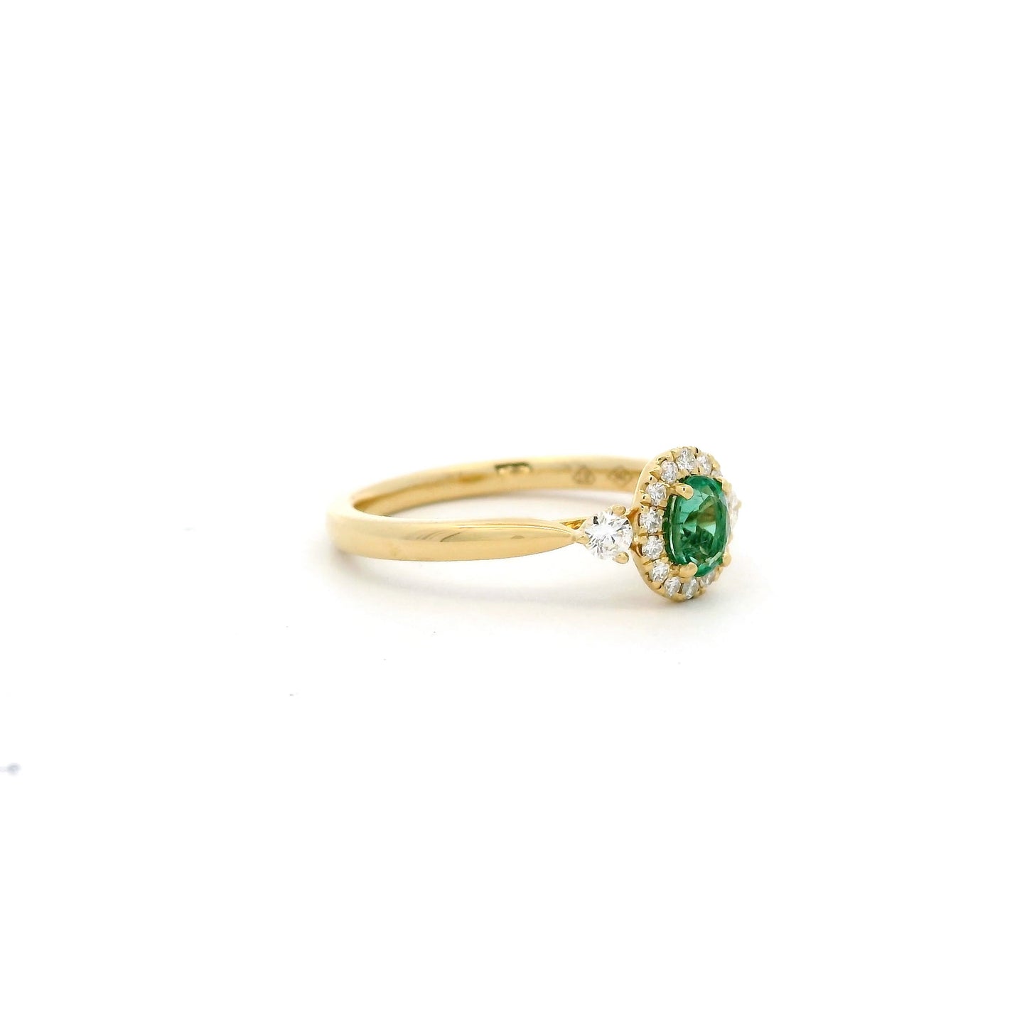 Oval Emerald And Round Diamond Cluster Ring