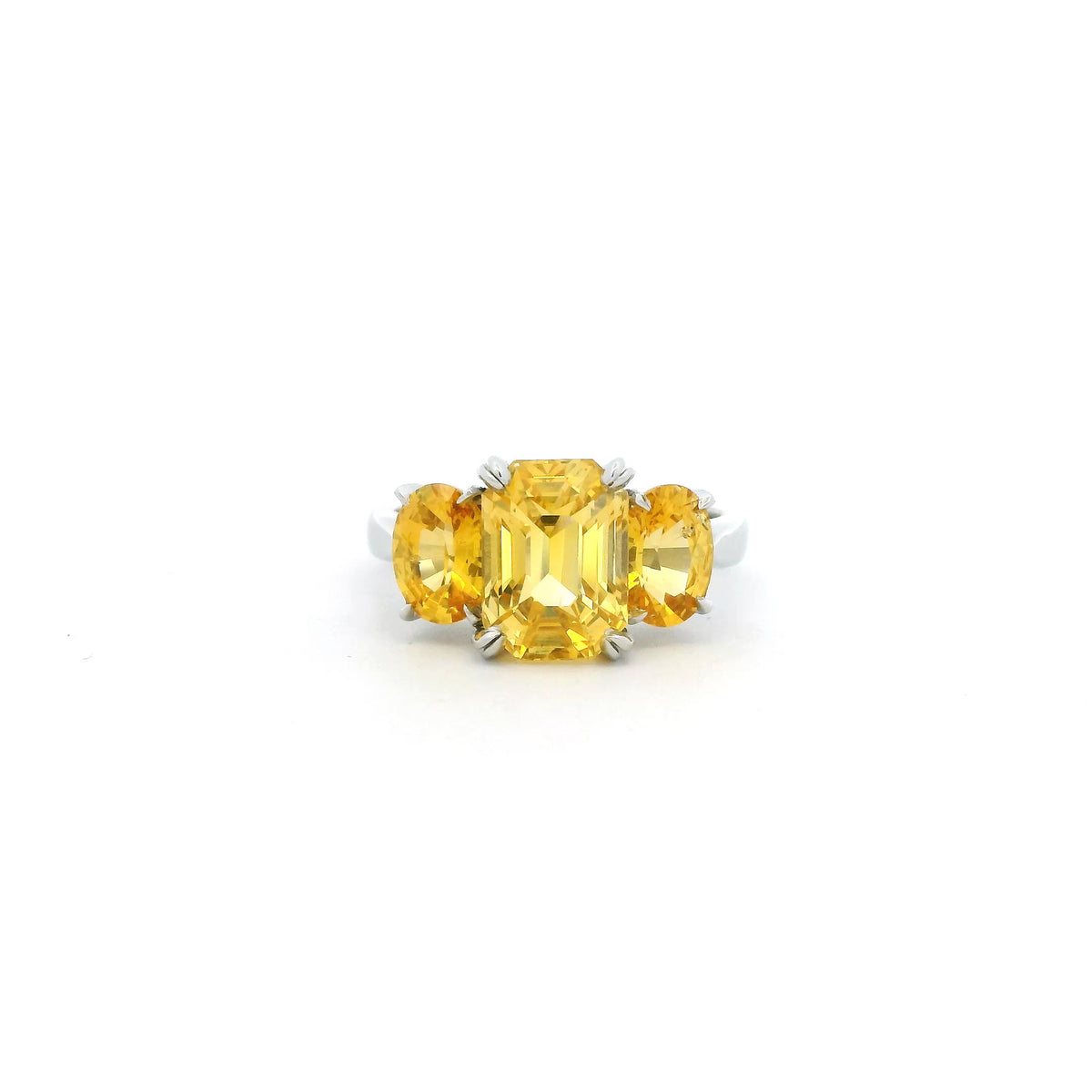 6.19ct Emerald And Oval Cut Yellow Sapphire Three Stone Ring