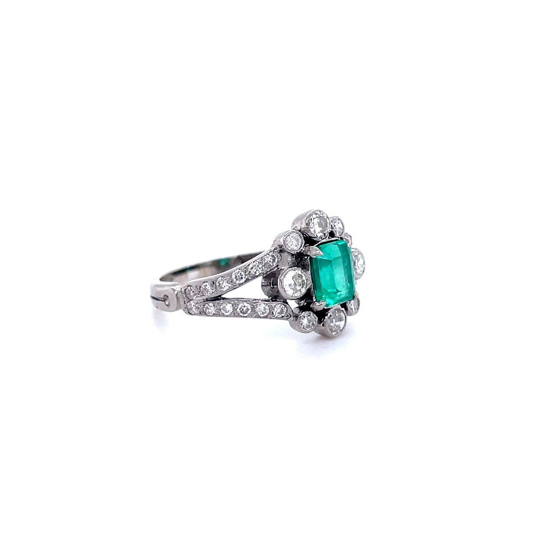 0.85ct Emerald Cut Emerald And Diamond Cluster Ring