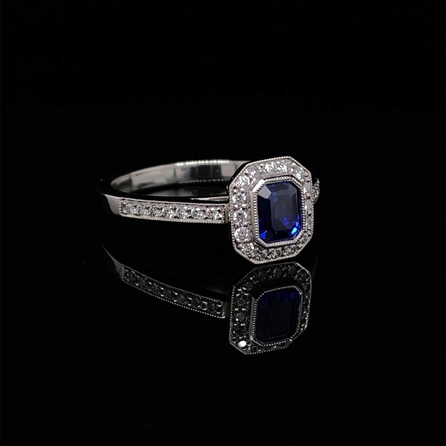 0.61ct Emerald Cut Sapphire and Diamond Cluster Ring