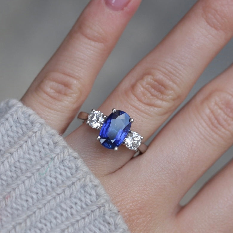 3.05ct Oval Cut Sapphire and 0.82ct Round Brilliant Diamond Three Stone Ring