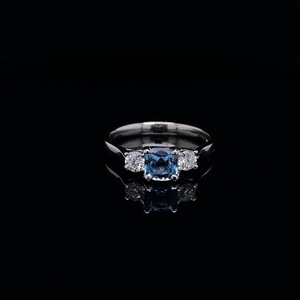 0.51ct Cushion Aquamarine And Round Diamond Three Stone Ring