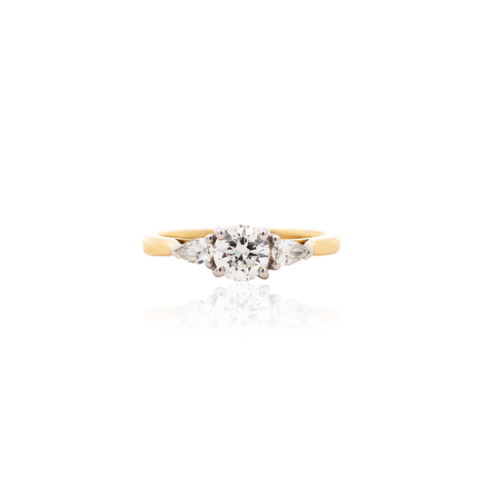 0.60ct Round Diamond And Pear Cut Diamond Three Stone Ring