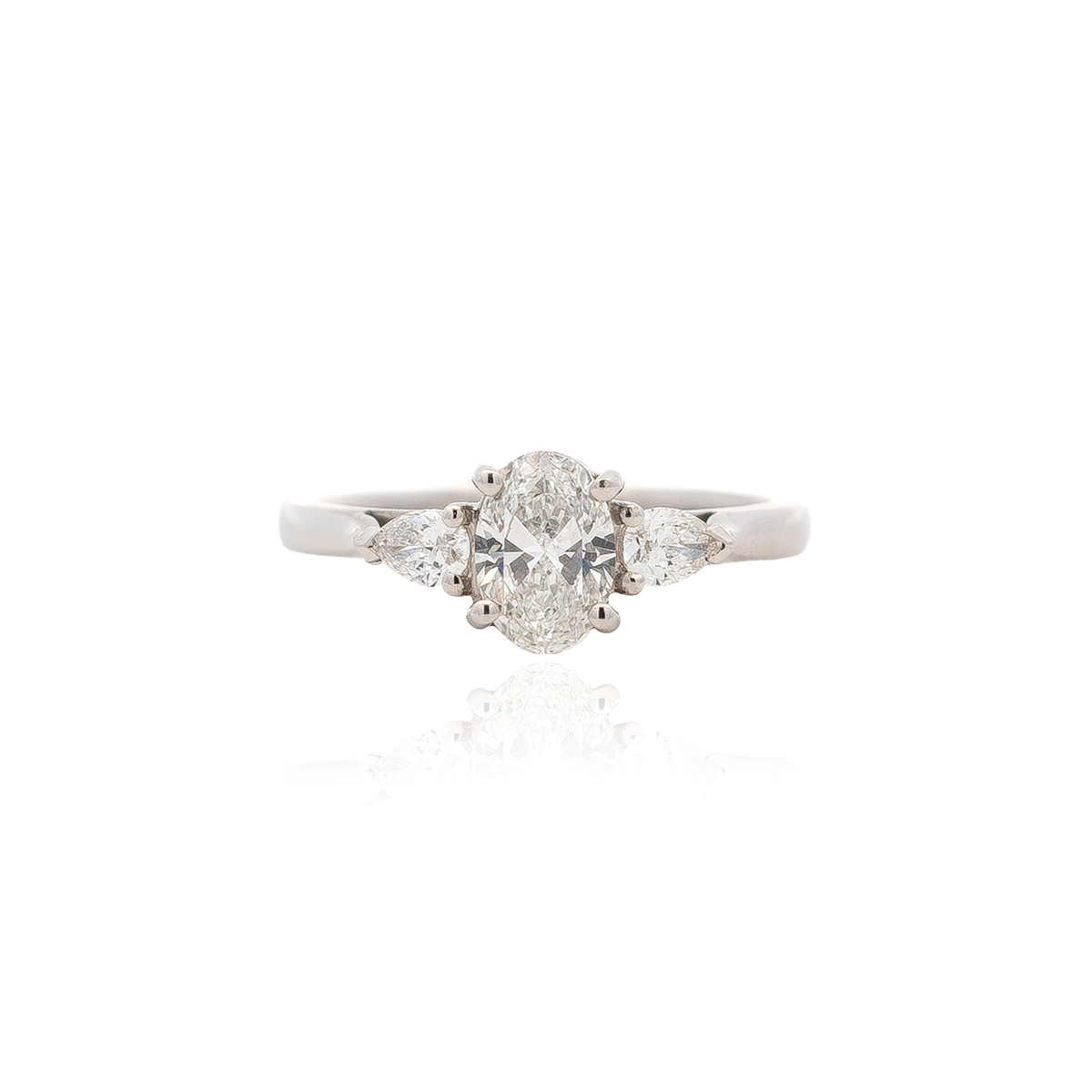 Certified 0.71ct Oval And Pear Cut Diamond Three Stone Ring