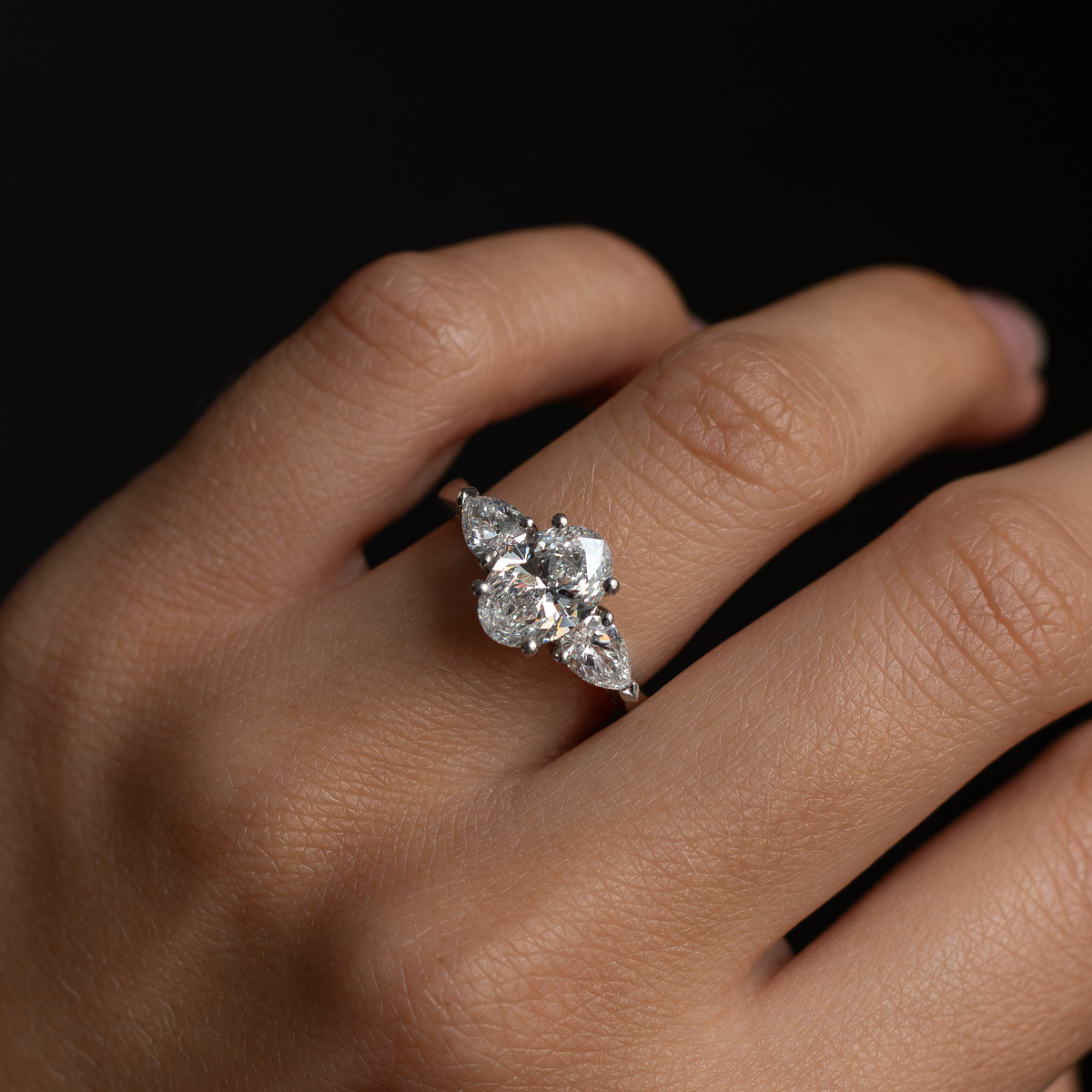 1.55ct Certified Oval Diamond And Pear Cut Diamond Three Stone Ring