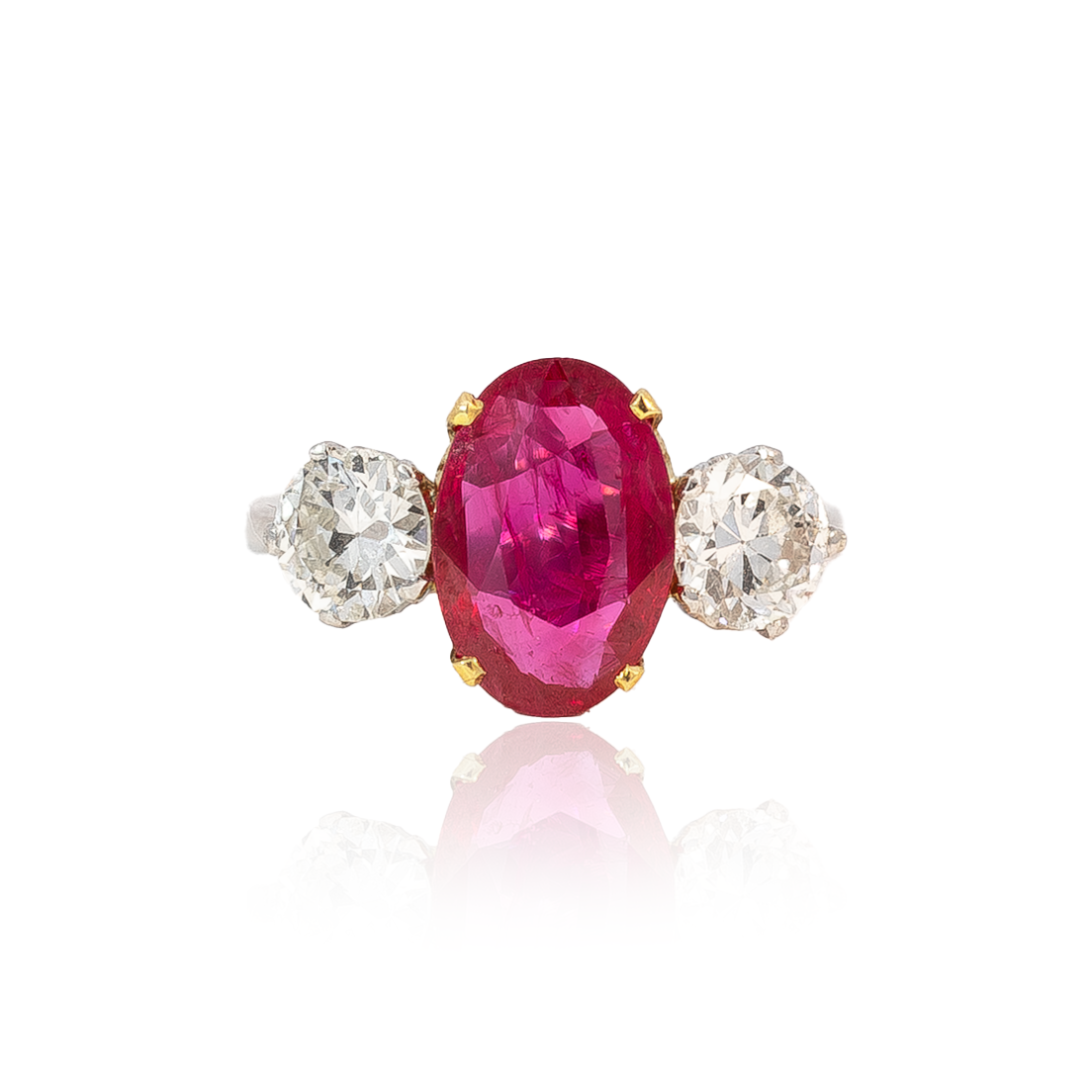 Oval Cut Ruby and Round Diamond Three Stone Ring