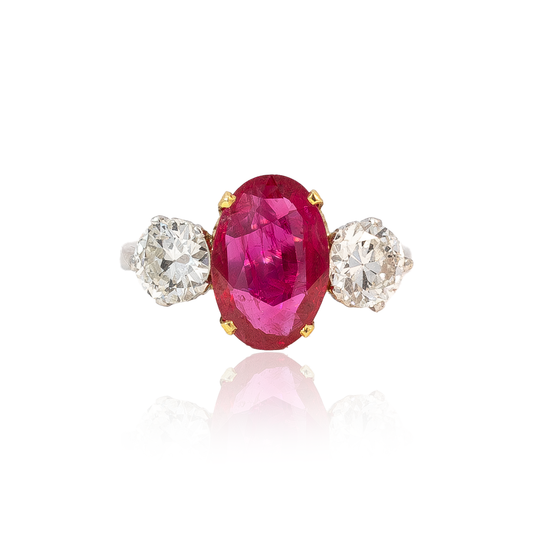 Oval Cut Ruby and Round Diamond Three Stone Ring