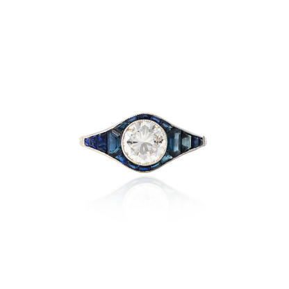 Round Diamond And Calibre Sapphire Cluster Ring