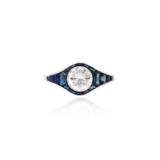Round Diamond And Calibre Sapphire Cluster Ring