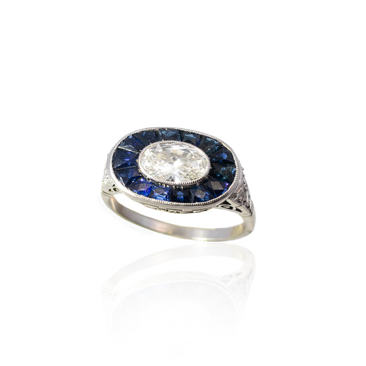 Oval Diamond And Calibre Sapphire Target Cluster Ring
