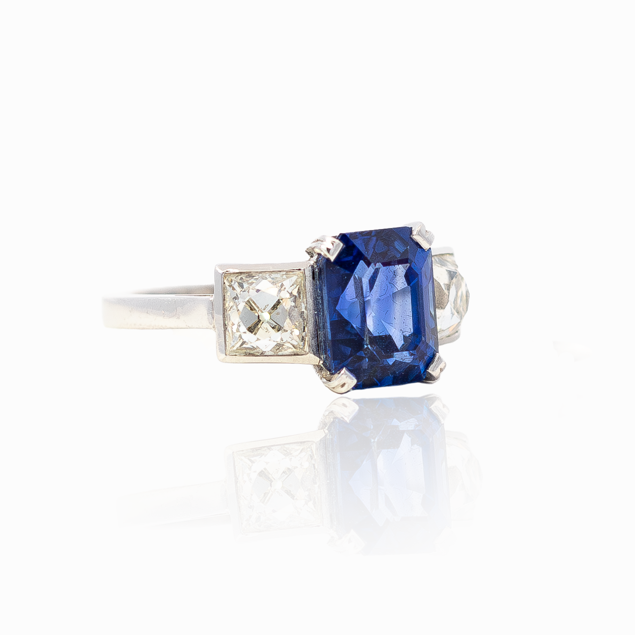 4.12ct Emerald Cut Sapphire And French Cut Diamond Three Stone Ring