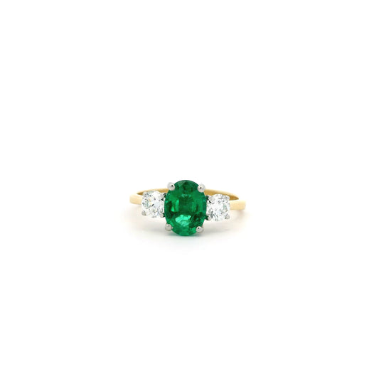 1.28ct Oval Emerald And Round Diamond Three Stone Ring