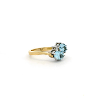 1.30ct Oval Aquamarine And Diamond Two Stone Cross Over Ring