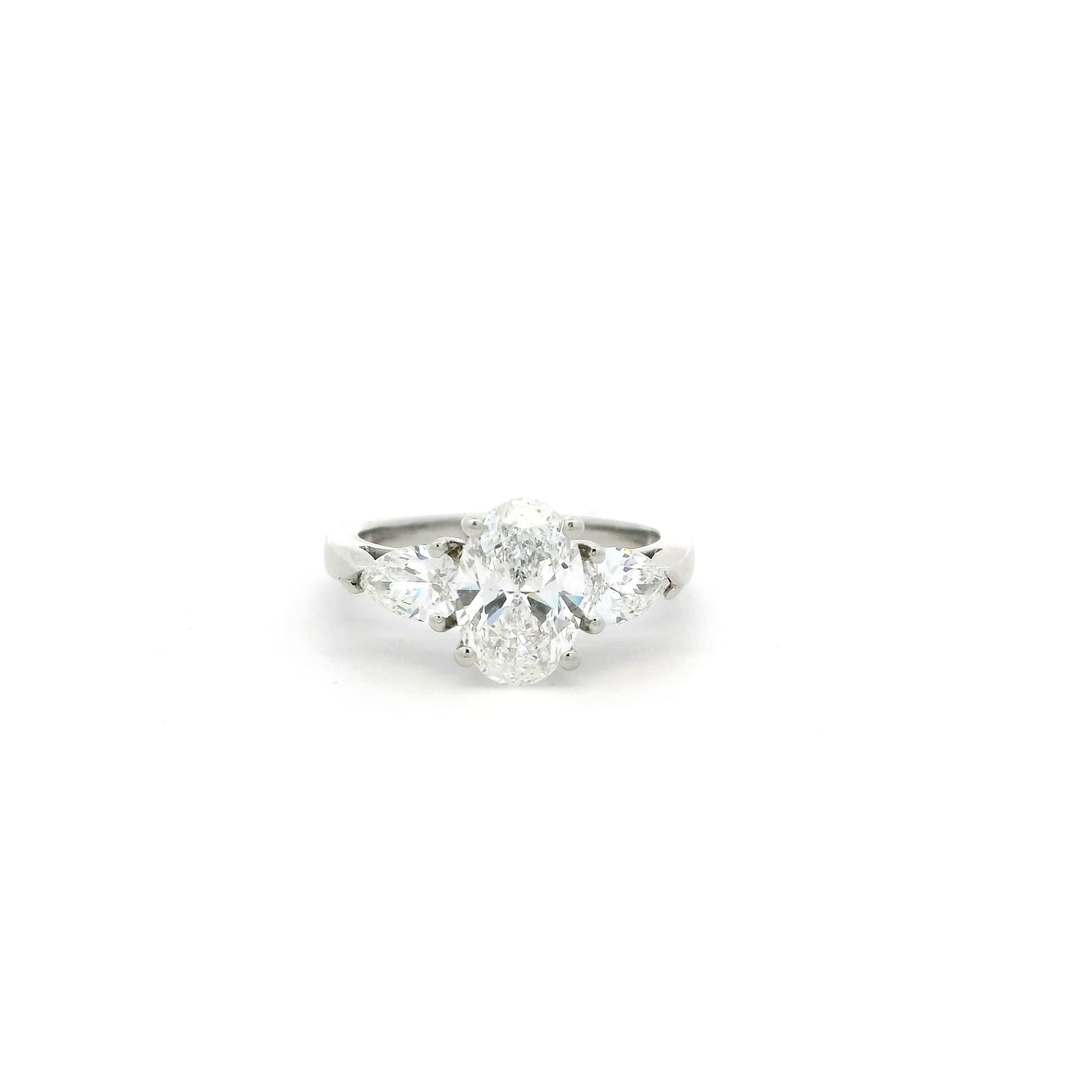 1.55ct Certified Oval Diamond And Pear Cut Diamond Three Stone Ring