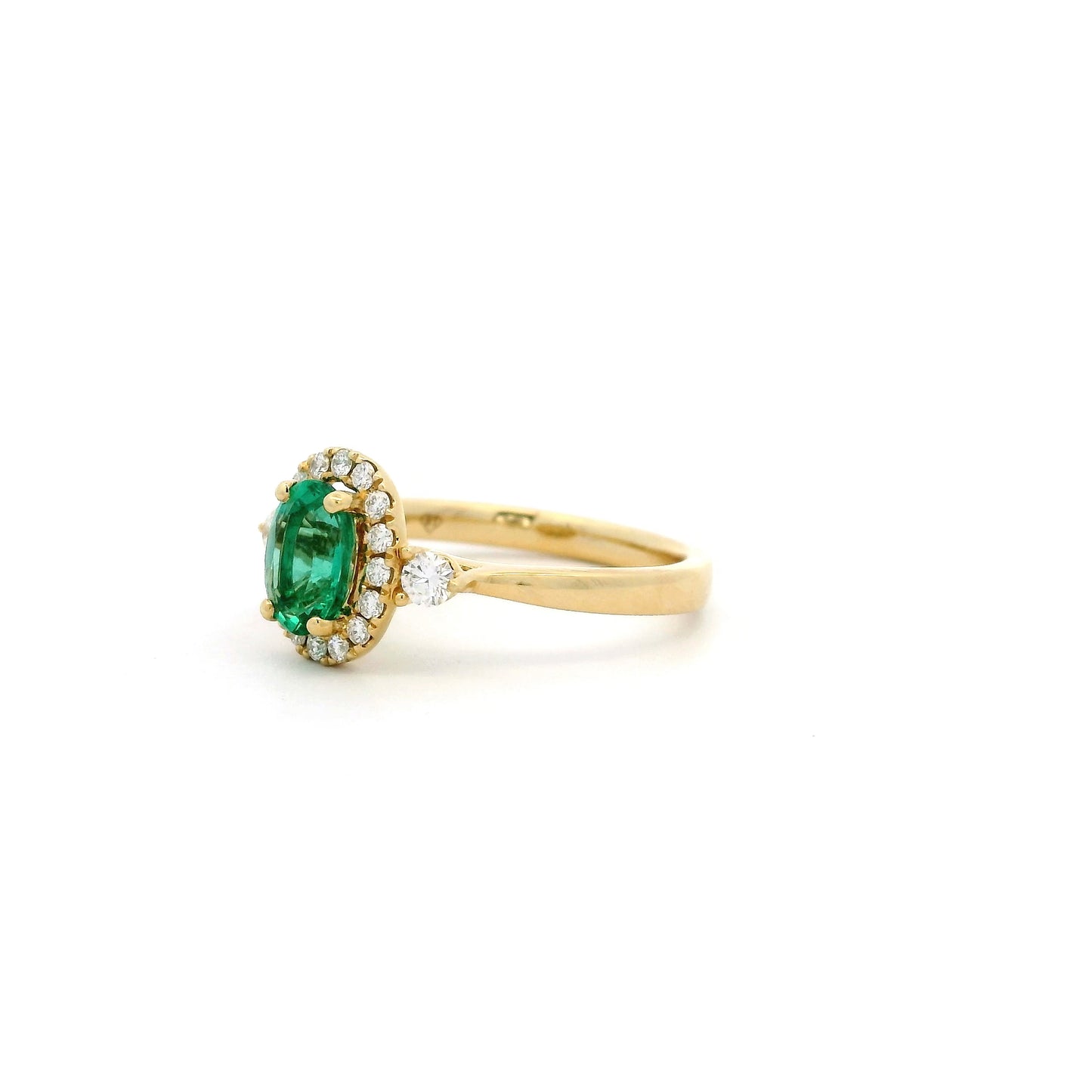 Oval Emerald And Round Diamond Cluster Ring