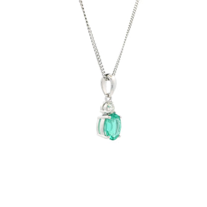0.61ct Oval Emerald And Round Diamond Pendant