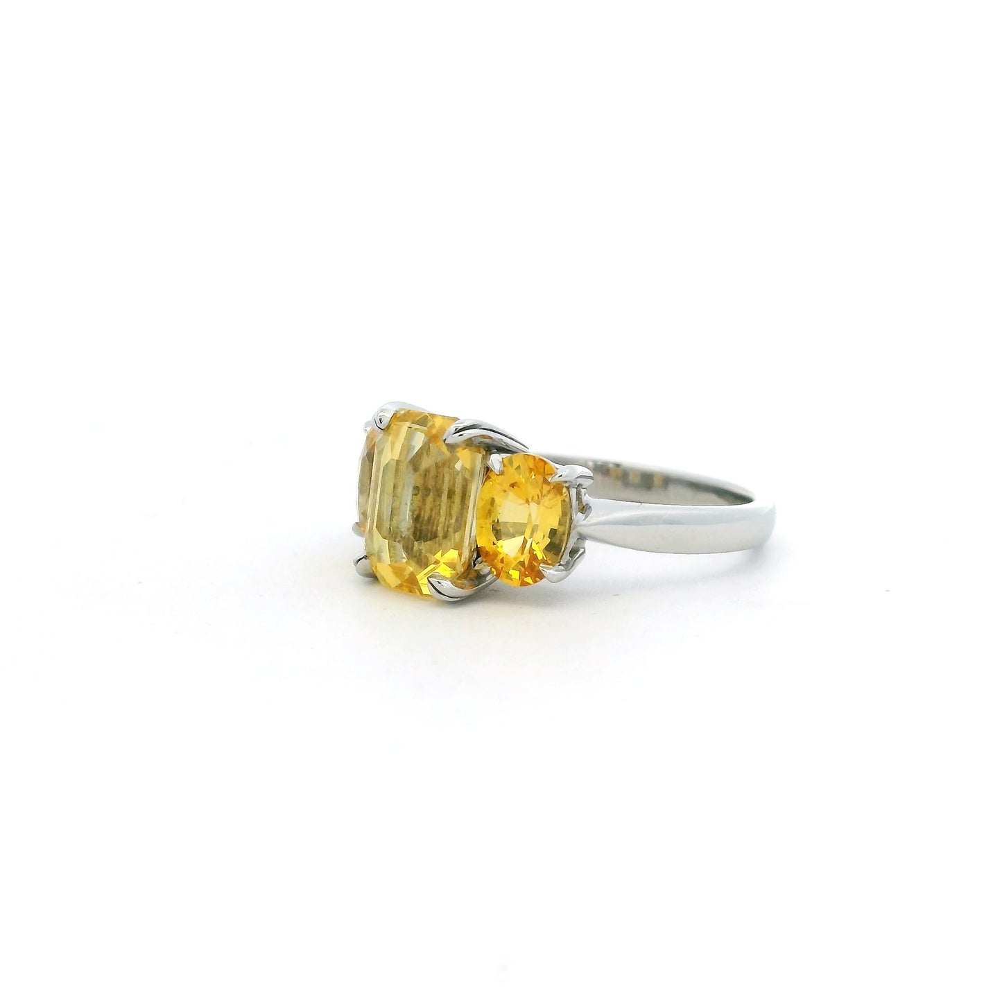 6.19ct Emerald And Oval Cut Yellow Sapphire Three Stone Ring
