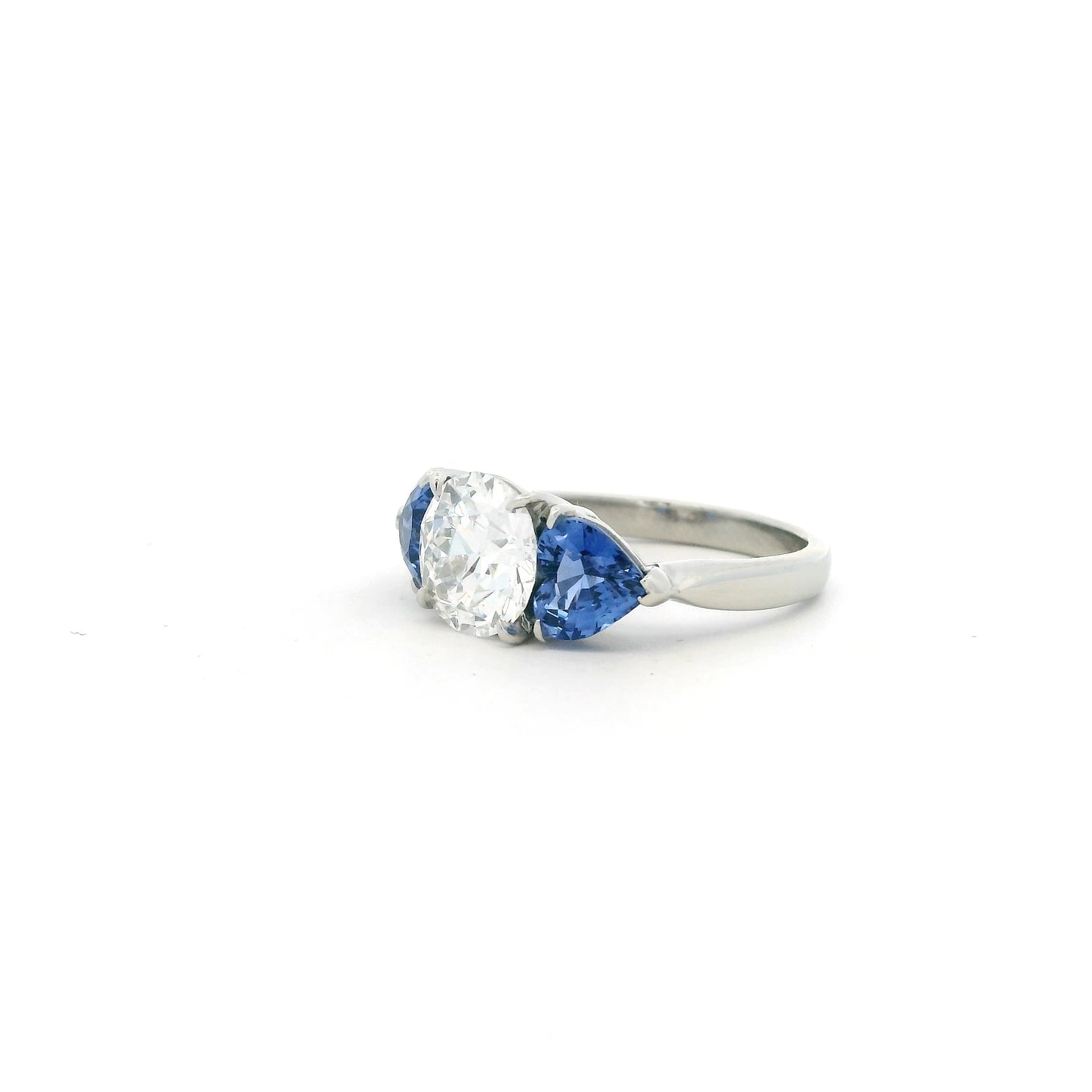 1.88ct Transitional Cut Diamond And Heart Cut Sapphire Three Stone Ring