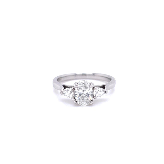 0.70ct Certified Oval Diamond And Pear Cut Diamond Three Stone Ring