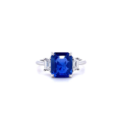 3.56ct Emerald Cut Sapphire And Trapeze Diamond Three Stone Ring
