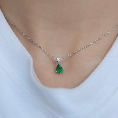 0.55ct Pear Cut Emerald And Round Diamond Pendant