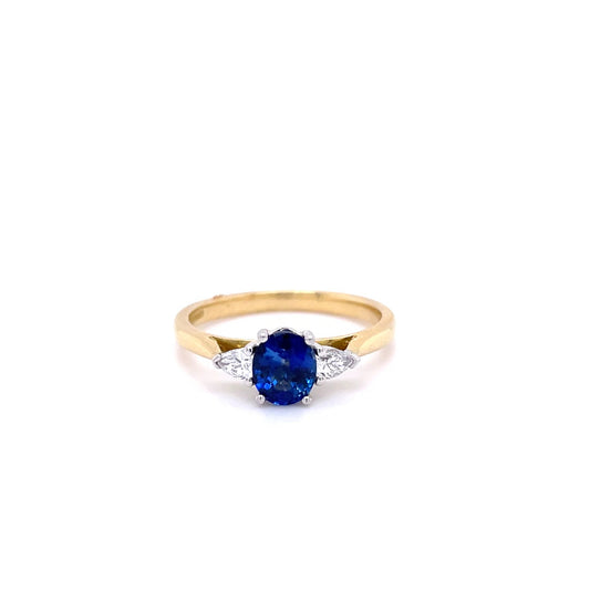 0.82ct Oval Sapphire And Pear Cut Diamond Three Stone Ring