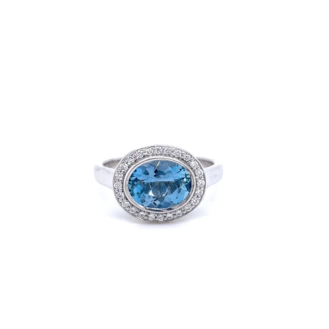 1.41ct Oval Aquamarine And Diamond Cluster Ring