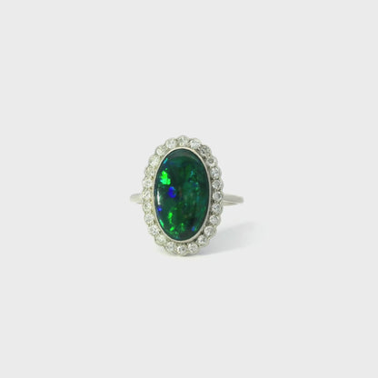 3.32ct Oval Black Opal And Round Diamond Cluster Ring