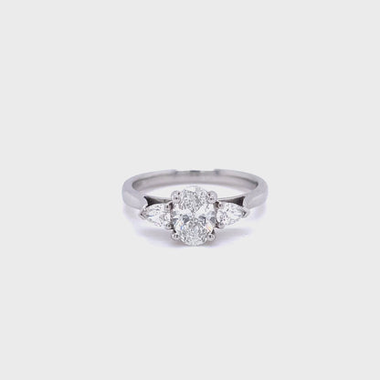 0.70ct Certified Oval Diamond And Pear Cut Diamond Three Stone Ring
