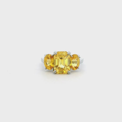 6.19ct Emerald And Oval Cut Yellow Sapphire Three Stone Ring