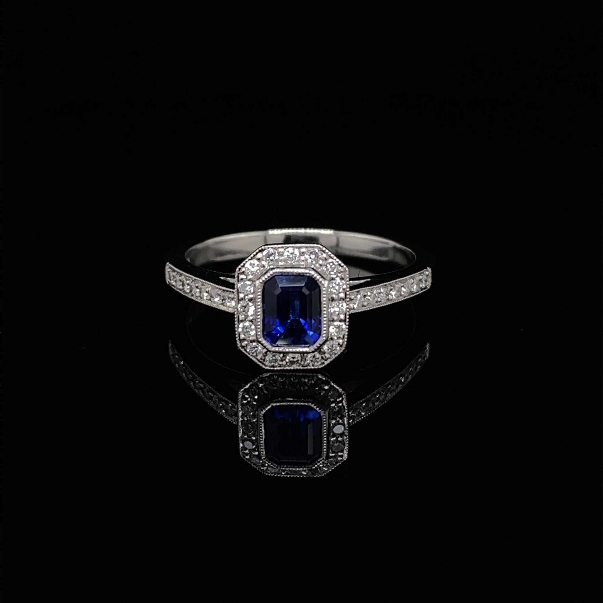 0.61ct Emerald Cut Sapphire and Diamond Cluster Ring