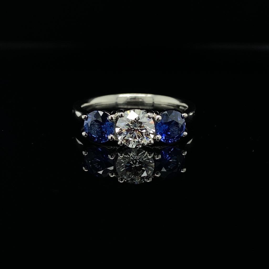 0.67ct Round Brilliant Cut Diamond and 1.07ct Sapphire Reverse Three Stone Ring