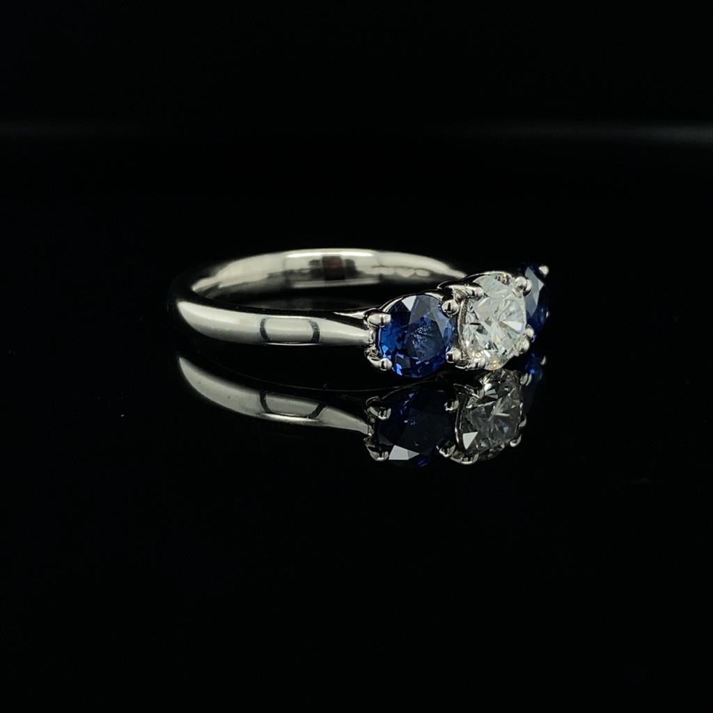 0.67ct Round Brilliant Cut Diamond and 1.07ct Sapphire Reverse Three Stone Ring