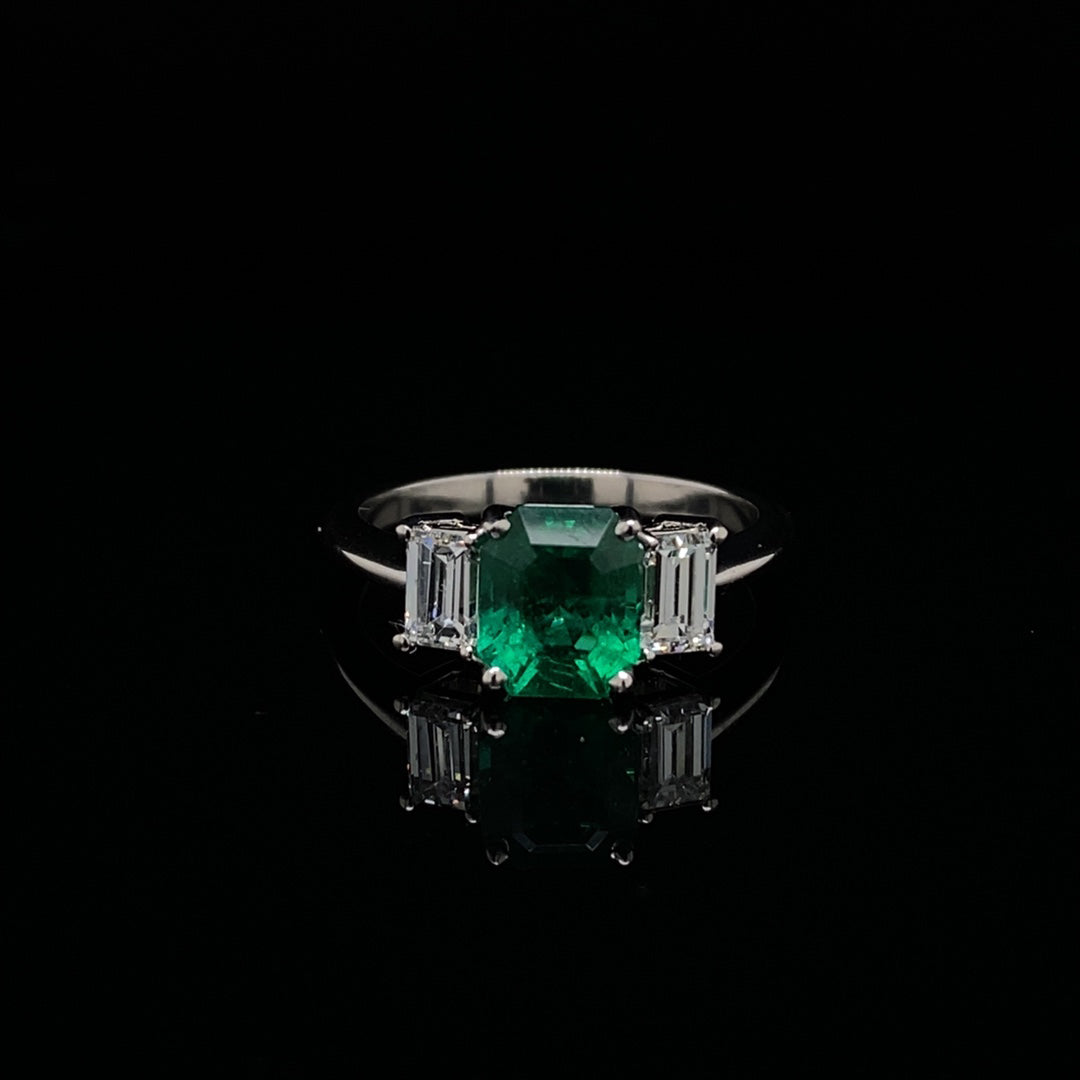 1.65ct Emerald Cut Emerald and Baguette Cut Diamond Three Stone Ring