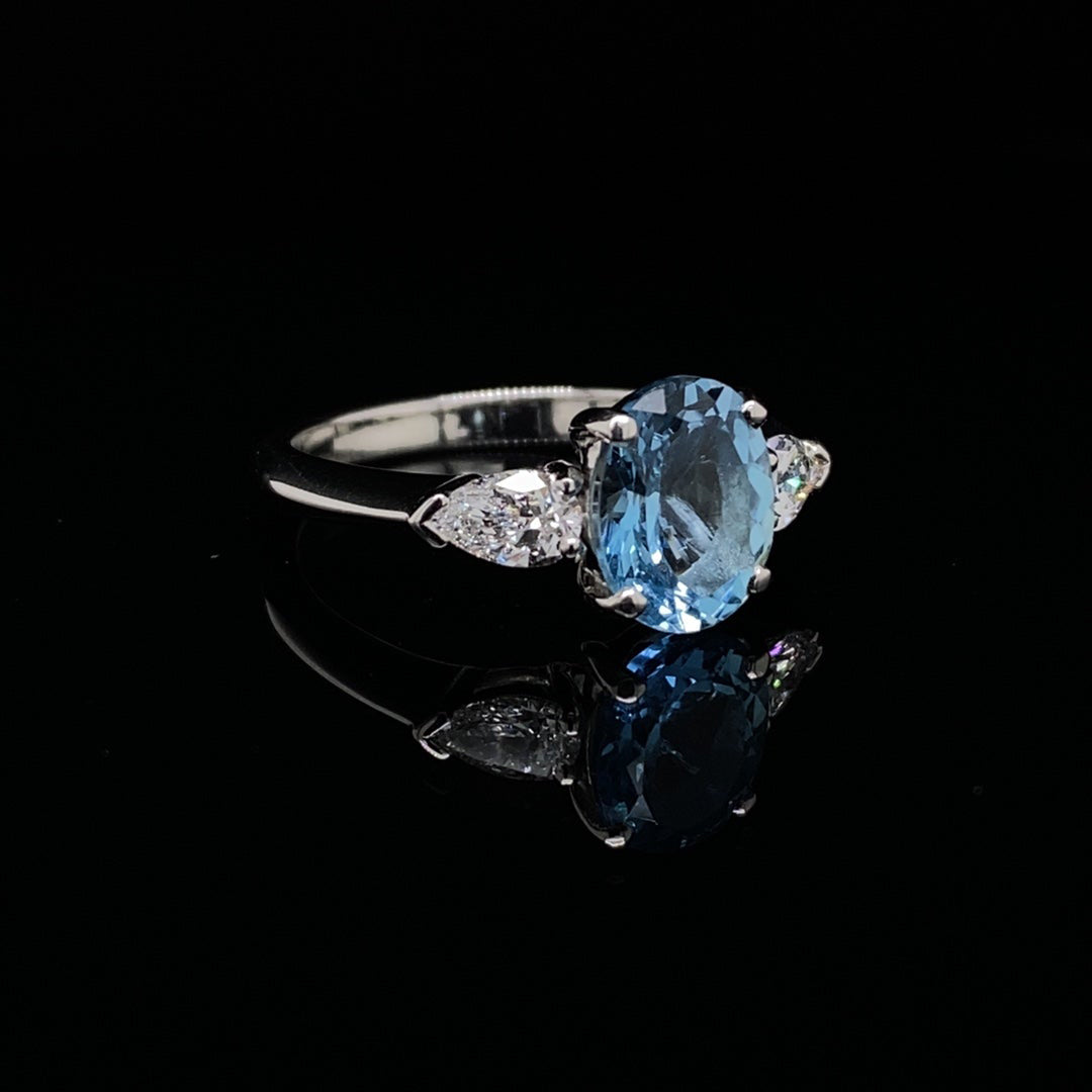 1.79ct Oval Aquamarine and Pear Cut Diamond Three Stone Ring