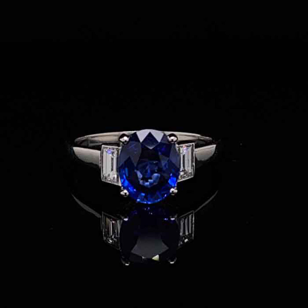 1.95ct Oval Cut Sapphire And Baguette Cut Diamond Three Stone Ring