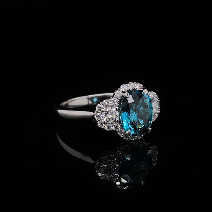 2.67ct Oval Cut Blue Zircon and Diamond Three Stone Cluster Ring