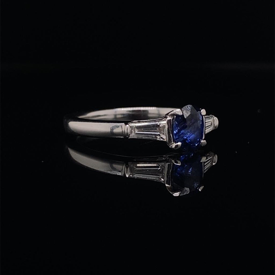 Oval Cut Sapphire and Tapered Baguette Cut Diamond Three Stone Ring
