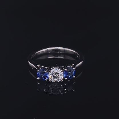 0.69ct Round Sapphire And Diamond Three Stone Ring