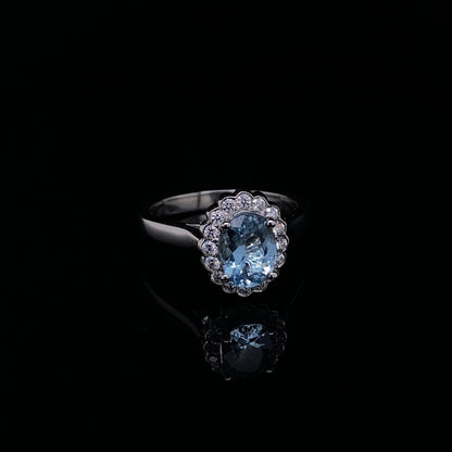 0.98ct Oval Aquamarine And Diamond Cluster Ring