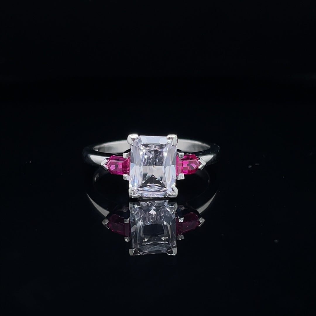 1.53ct Radiant Cut White Sapphire And Ruby Three Stone Ring