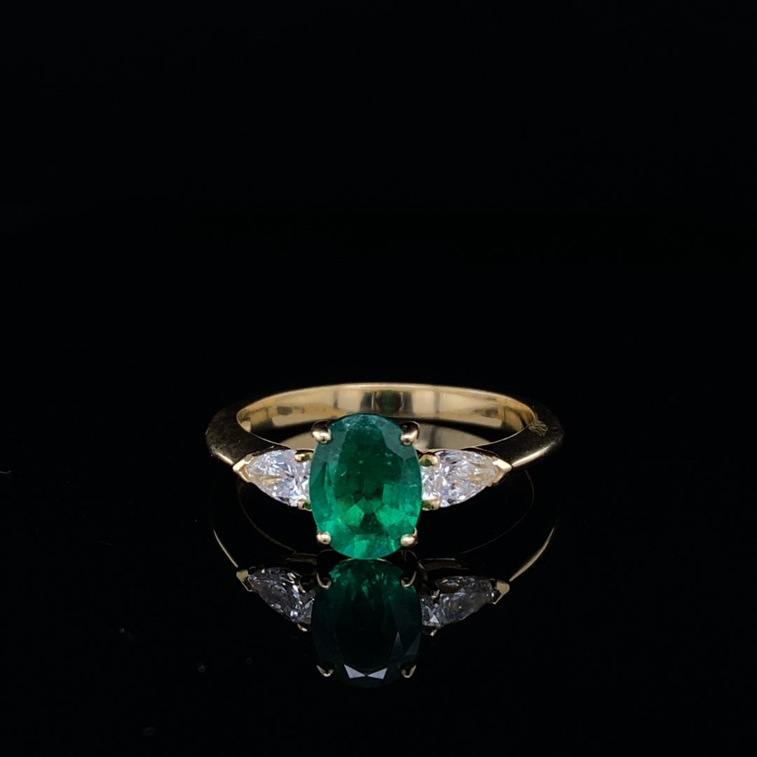 0.96ct Oval Emerald And Pear Cut Diamond Three Stone Ring