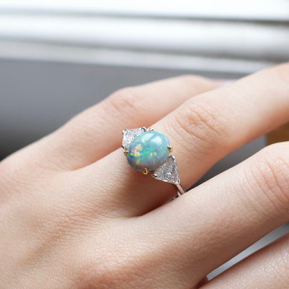 1.93ct Cabochon Oval Opal And Trilliant Cut Diamond Three Stone Ring