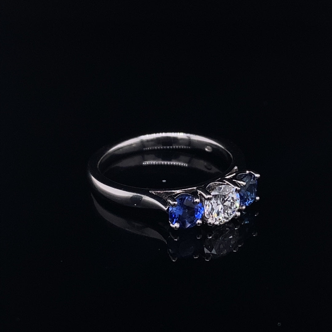 0.69ct Round Sapphire And Diamond Three Stone Ring